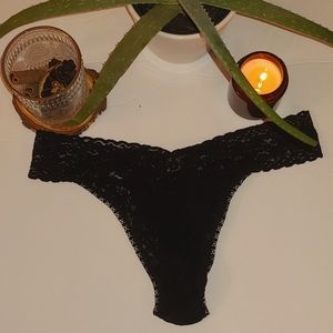 Hanky Panky signature black lace rise thong panty.